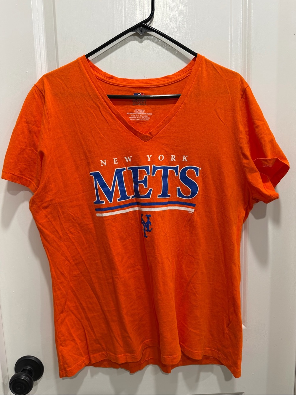 Genuine Merchandise Orange V-Neck Women's Tee with Blue Logo Accent